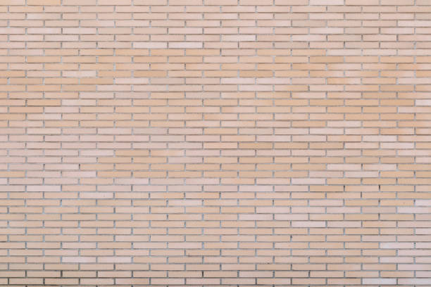 istock building wall brick wall. orange earthy beige brick texture. 1196647360