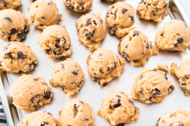 istock Homemade chocolate chip cookies dough scoops on a baking sheet. 1196648269