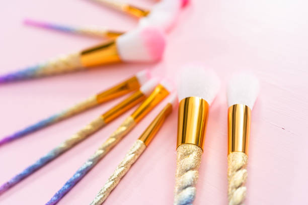 istock Unicorn color makeup brushes on a pink background. 1196652088