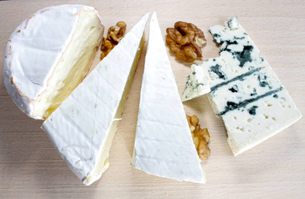 istock Soft cheese and blue cheese on a wooden board. 1196652255
