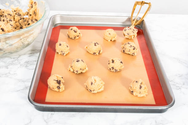 istock Homemade chocolate chip cookies dough scoops on a baking sheet 1196653289