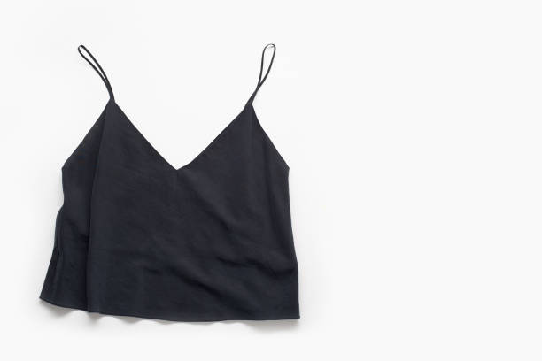 istock Black female top with narrow straps on white background. Minimalistic flatlay. 1196653626
