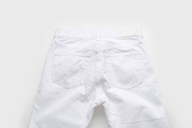 istock White jeans on white background. Monochromatic flatlay 1196653645
