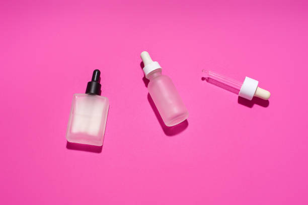 istock Serum bottles on pink background. Cosmetic flatlay 1196653741