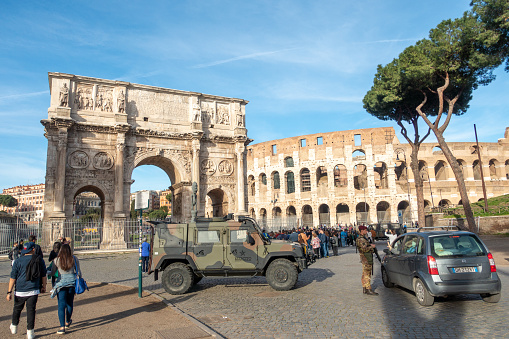 Rome, Italy – August 01, 2016: A partial view of the Rome Colosseum from one of the streets at a high level showing the architecture and business