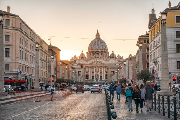 March 10, 2017 - Rome, Italy: tourists going to saint Pete's Basilica at sunset. Rome