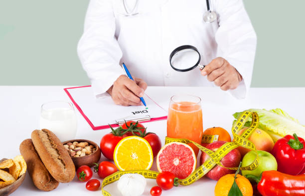 istock diet specialist doctor with food 1196655883