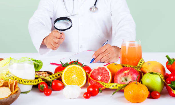 istock diet specialist doctor with food 1196655962