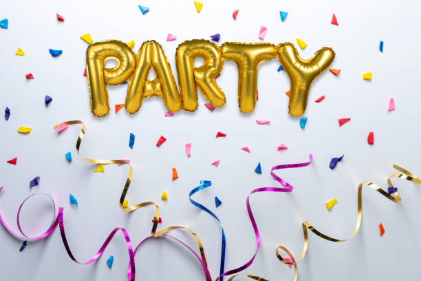 istock Creative composition made with Party foil balloon and colorful streamers on white background. Minimal celebration party concept. 1196660556