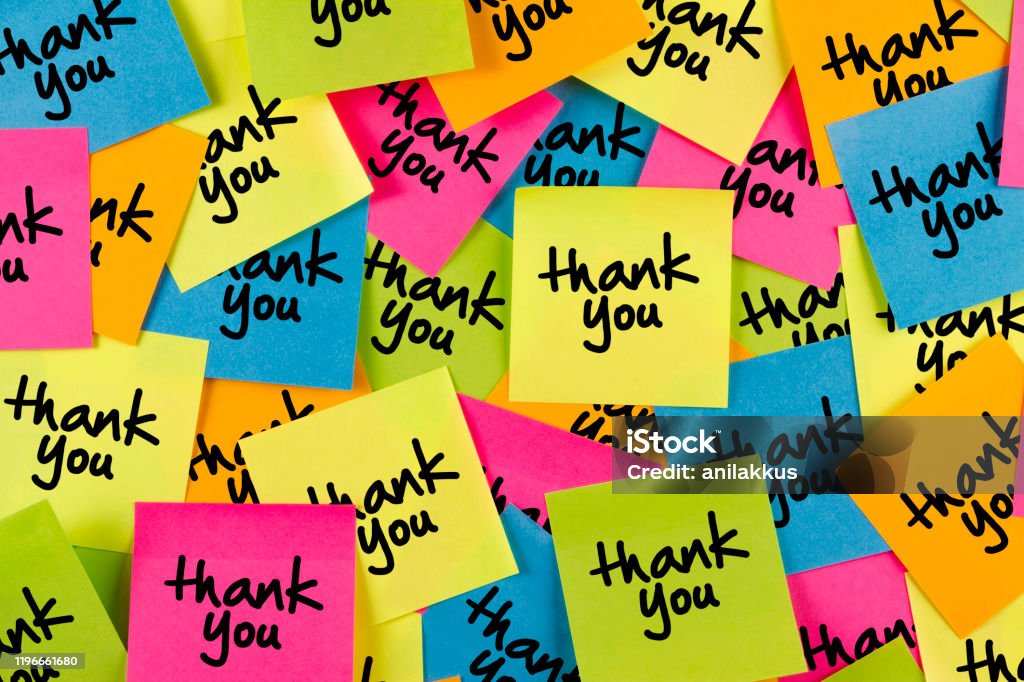 Thank You Message on Adhesive Notes on Bulletin Board Thank you sticky note with multiple colored adhesive notes on bulletin board Thank You - Phrase Stock Photo