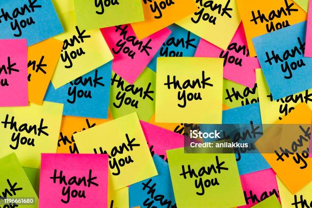 Thank You Message On Adhesive Notes On Bulletin Board Stock Photo - Download Image Now