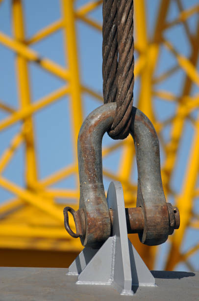 istock Crane cable that is attached to the steel ring. 1196662425