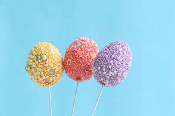 istock Group of colorful Easter eggs on sticks 1196662441