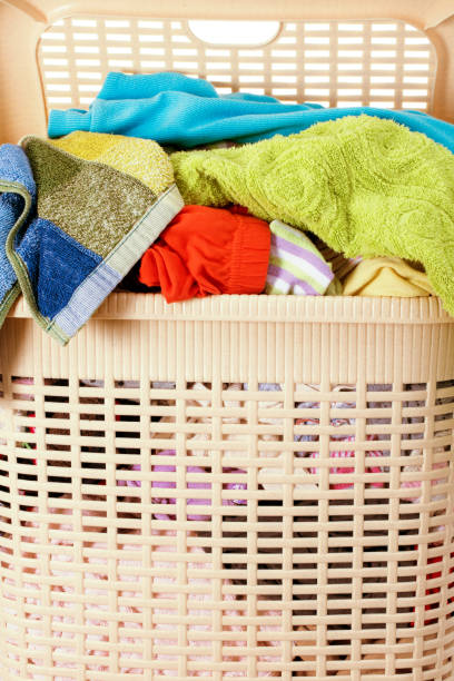 istock Laundry basket full of dirty washing 1196663123