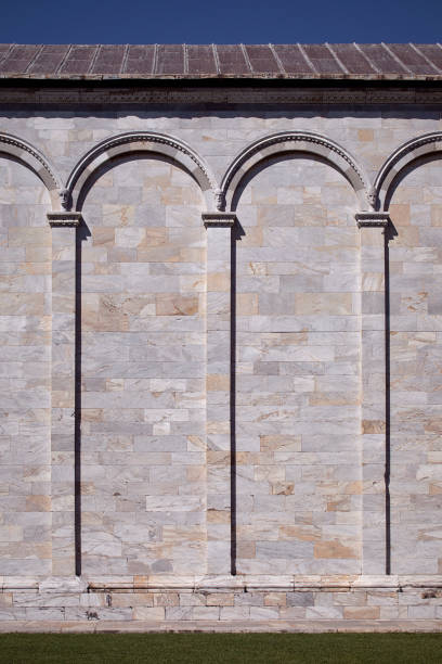 Marble bricks wall. Decorative columns and arches. Classical wall.