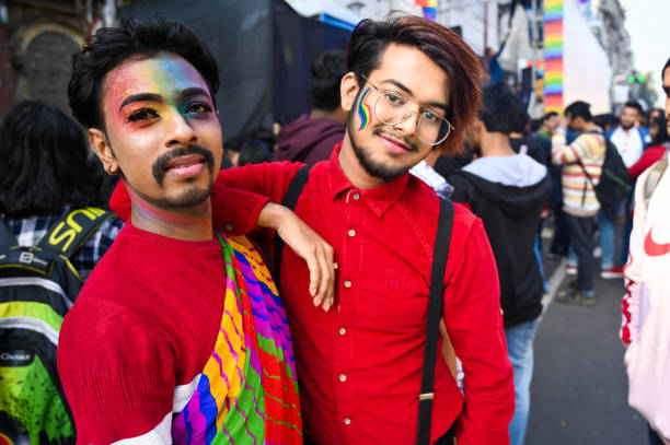 gay and lesbian ( lgbtq ) community  holding rainbow flag and participates in a rainbow pride walk in kolkata, india - flag rainbow gay pride flag gay man imagens e fotografias de stock