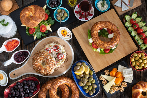 Traditional Turkish breakfast with Turkish bagel simit on the table. We call it gevrek at izmir. Food concept on the table at the restaurant. sesame bagel stock pictures, royalty-free photos & images