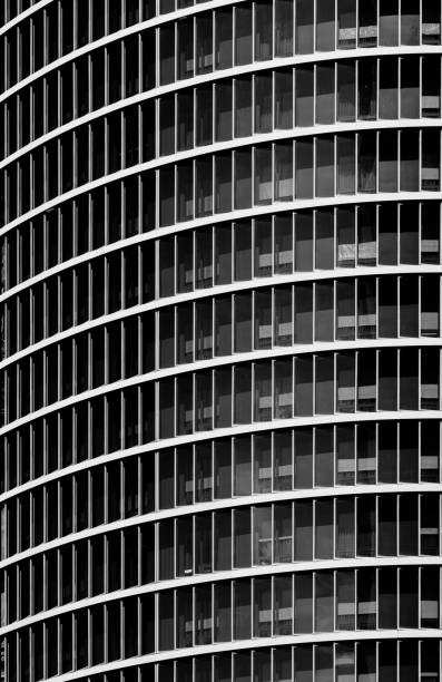 istock black and white office building with windows 1196672524