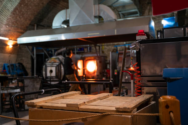 smelting glass in a high temperature furnace - glass factory imagens e fotografias de stock