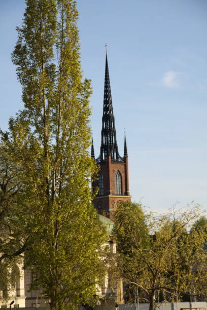 istock Old church in the autumn park 1196674077