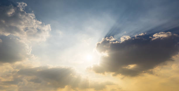 istock The shining sun on sky and clouds  nature sunrise or sunset background 1196679148