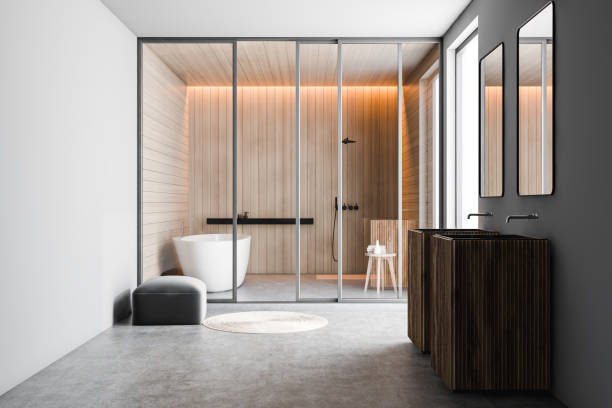istock Gray and white bathroom, double sink and tub 1196682595