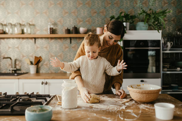 istock Mother and son making cookies 1196685479