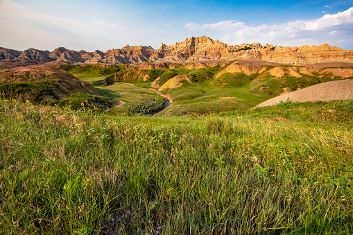 Interior, USA - June 14, 2023. Family walking on trail at Badlands National Park, South Dakota, USA