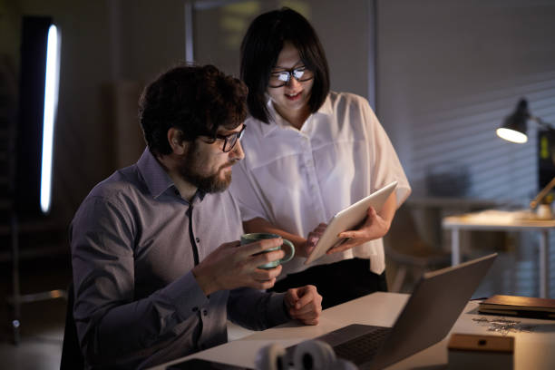 istock Business people working over online presentation 1196691666