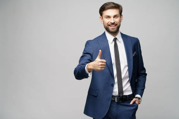 istock young business man going thumb up on grey background 1196693275