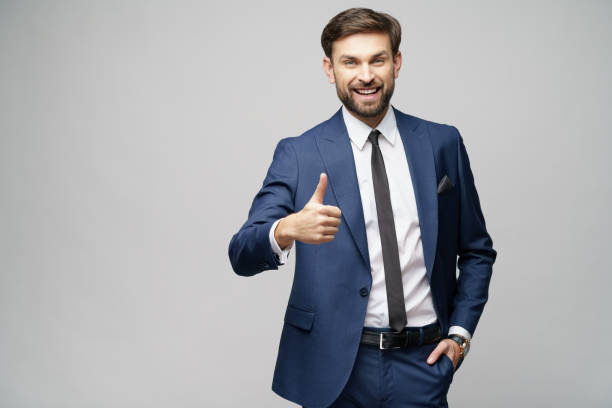 istock young business man going thumb up on grey background 1196693278