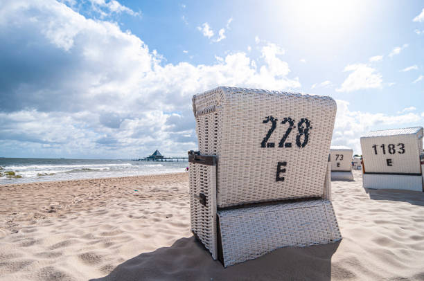 Stranbasket by the Sea Beach chair by the sea hooded beach chair stock pictures, royalty-free photos & images