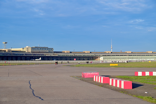 Berlin, Germany - December 29, 2019: View over the area of the former Tempelhof airport in the center of Berlin, which is now used as a recreation area for walking, cycling, skating and kiting.