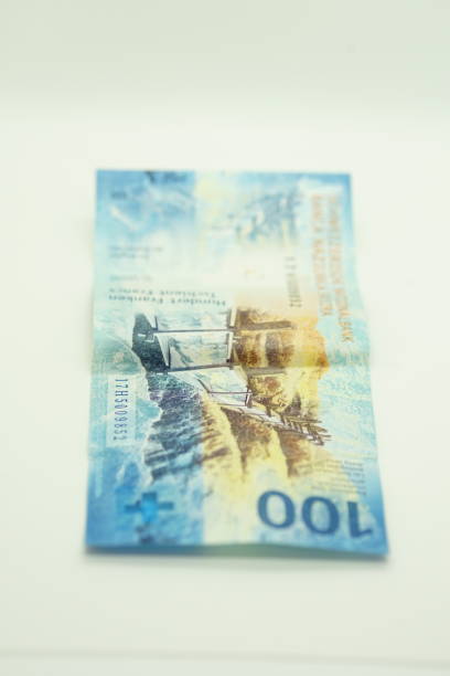 A pile of 50 Swiss franc banknotes -  selective focus