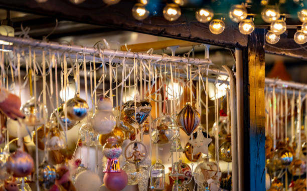 istock 2019 Christmas tree baubles on a market stall 1196701100