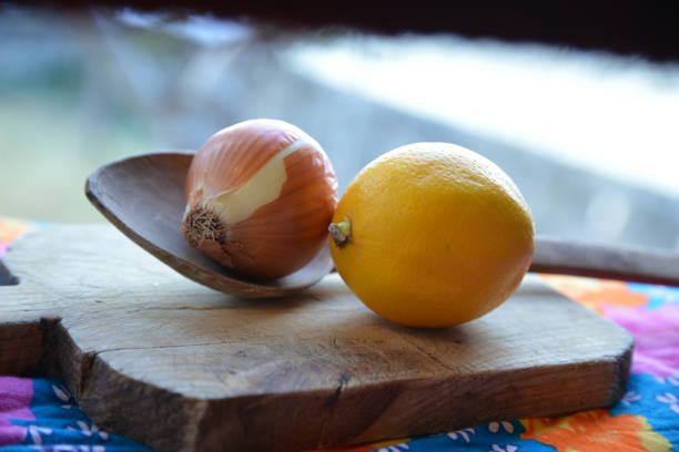 onion and lemon on chopping board