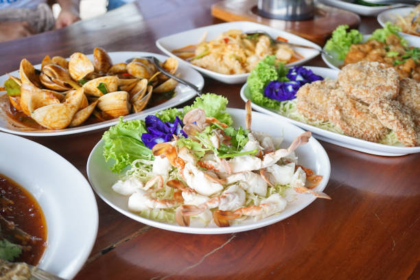 Seafood dishes. A lot of seafood dishes with soft focus on the steamed crab. stock photo