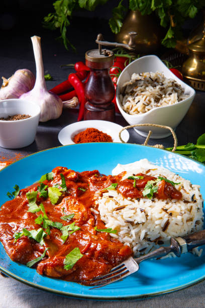 istock Indian Chicken Tikka Masala with wild rice 1196702413