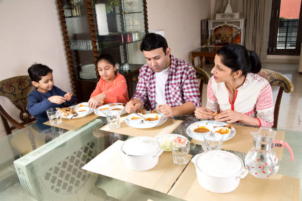 istock Family having lunch at home 1196703595