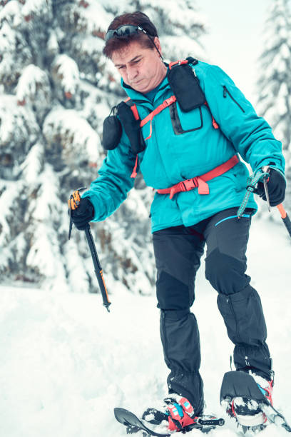 istock Senior Male Alpinist Working His Way Through Snow 1196704400