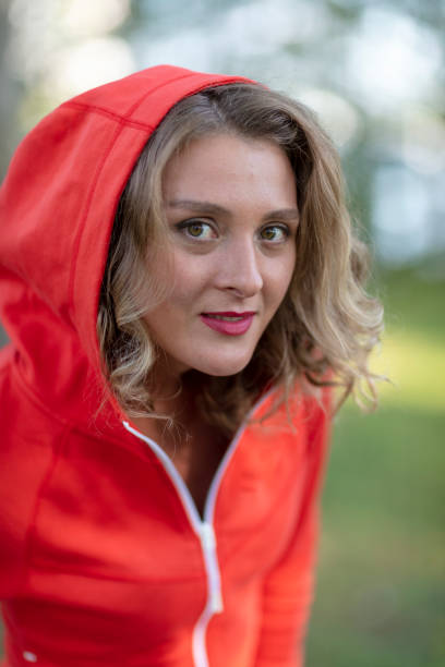 istock Beautiful girl in a red sweatshirt 1196704685