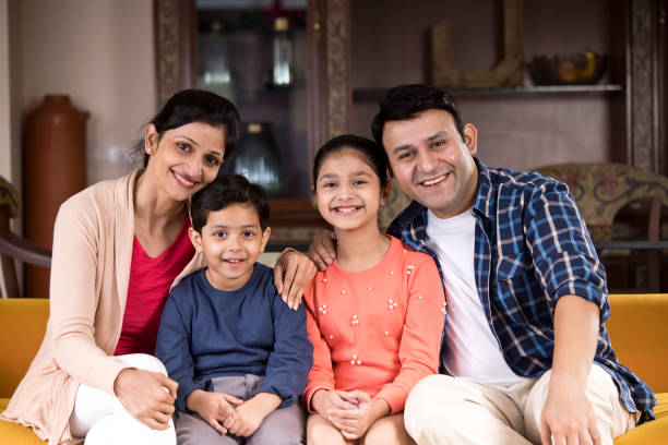happy indian family at home - asian ethnicity child four people couple imagens e fotografias de stock