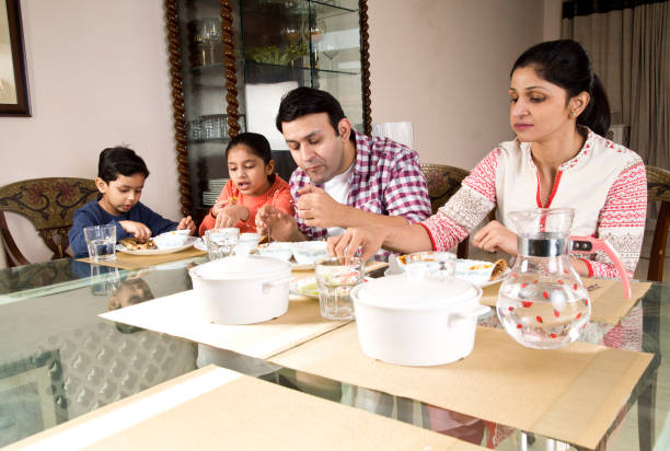 istock Family having lunch at home 1196708850
