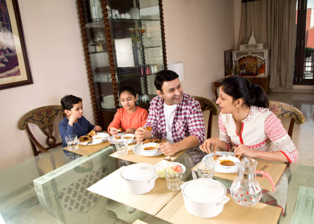 istock Family having lunch at home 1196708936