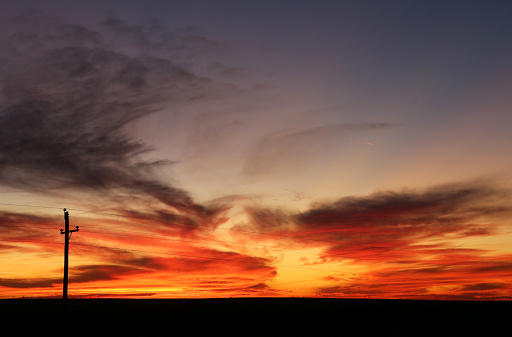 Sunset with a utility pole near Midland, TX