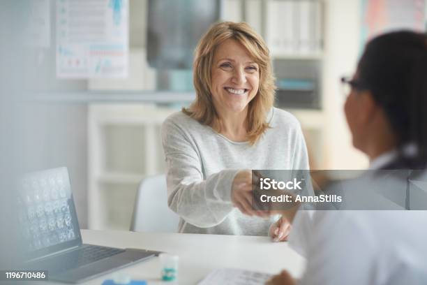 Patient Visiting Her Doctor Stock Photo - Download Image Now - Doctor, Patient, Women