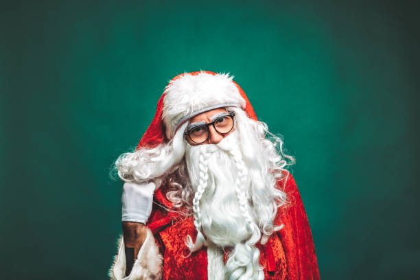 istock Mischievous Santa Claus close up portrait 1196712776