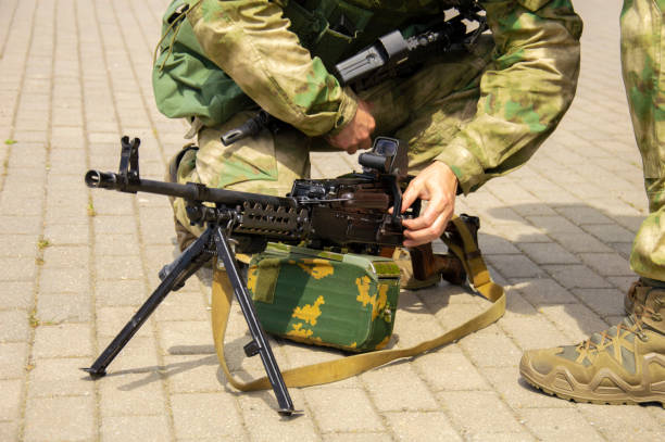 istock Special-purpose team arrived at the exercises. They unload weapons and special equipment from a minibus. The concept of defense, the Ministry of Defense, political instability, war. 1196712854