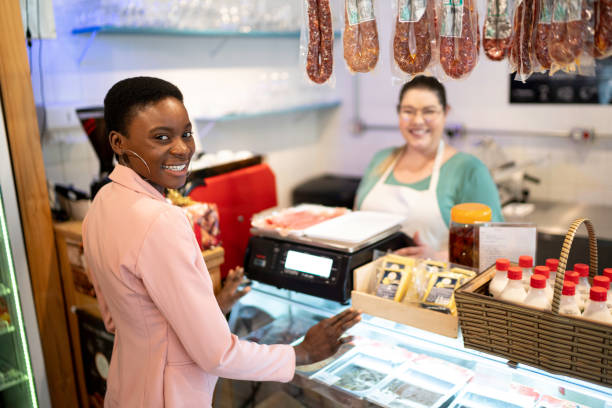 istock Portrait of customer byuing some cold cuts with a butcher 1196714875