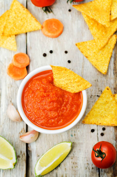 istock blended red salsa on the wood background 1196716045